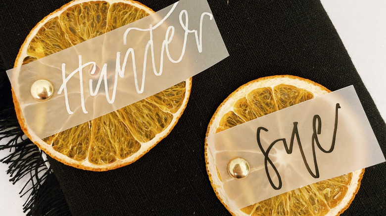 Dried orange slices with name tags
