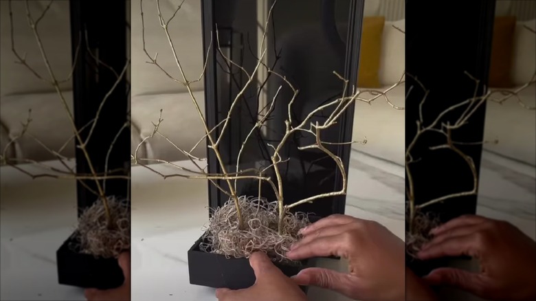 A blogger creates a DIY wall sconce