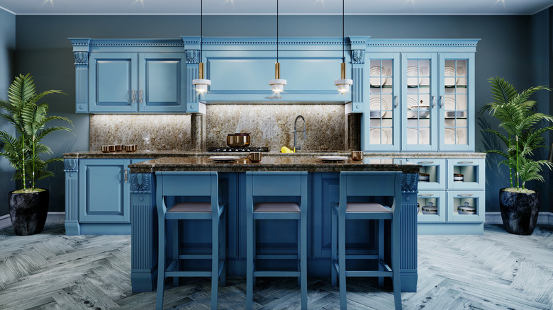 modern blue kitchen with palms