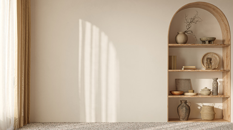 A living room with an arch wall treatment