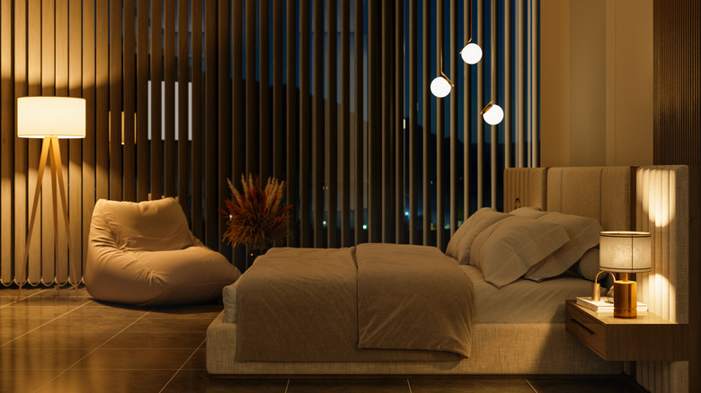 modern bedroom interior with side view of night table And Double Bed At Night
