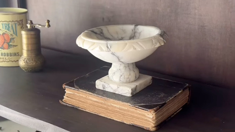 alabaster bird bath on shelf