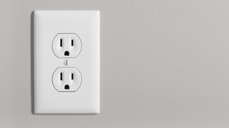 white outlet cover on a beige wall