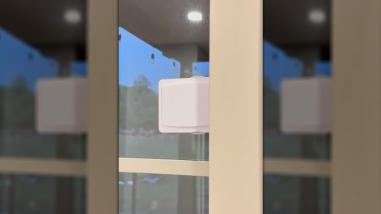 A sliding glass door lock on a door