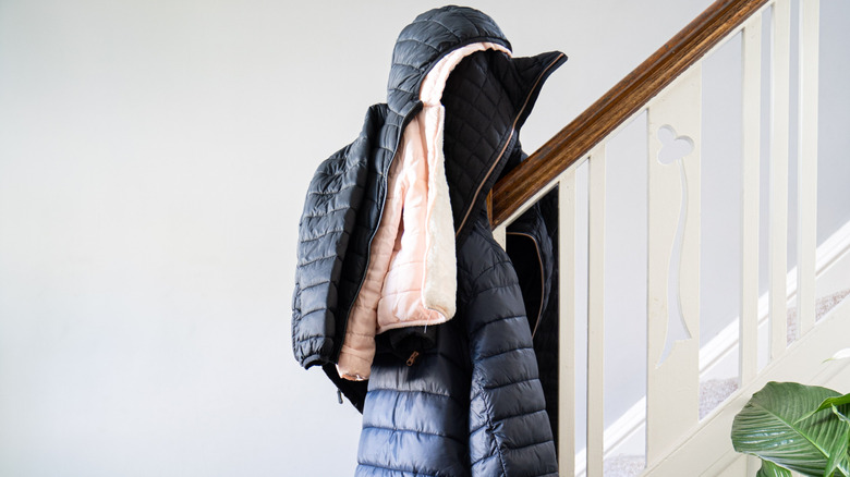 kids coats and hanging from banister.