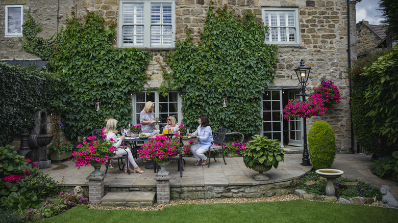 women enjoying an outdoor party on a patio