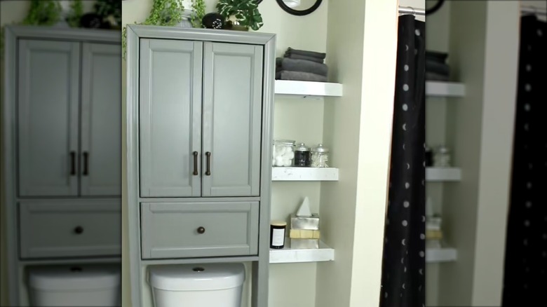 Corner shelves made from dollar tree trays next to a toilet