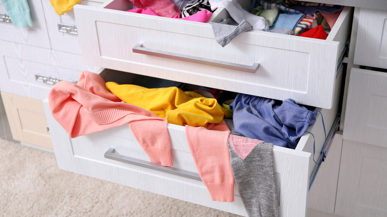 drawers with clothes falling out