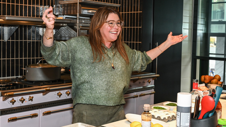 Chef Rachael Ray smiles in a kitchen