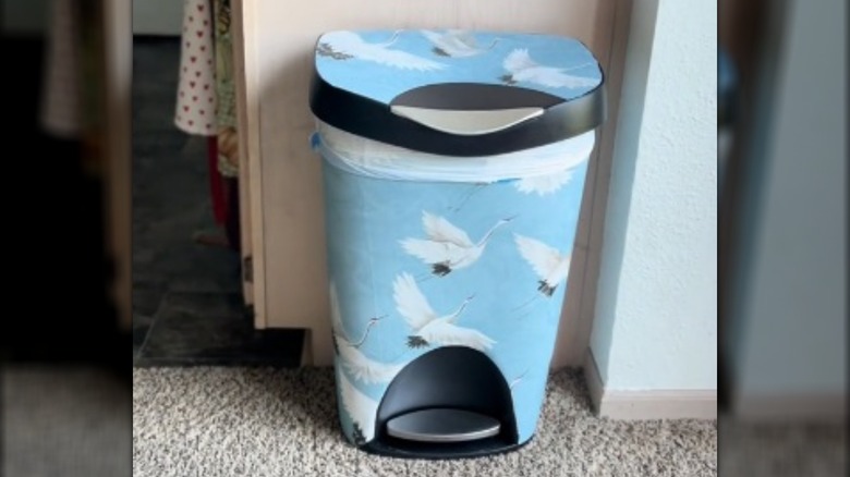 Trash can wrapped in peel-and-stick paper