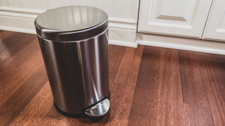 Silver trash can in kitchen