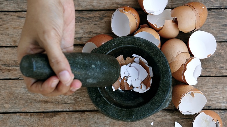 Person crushing eggshells