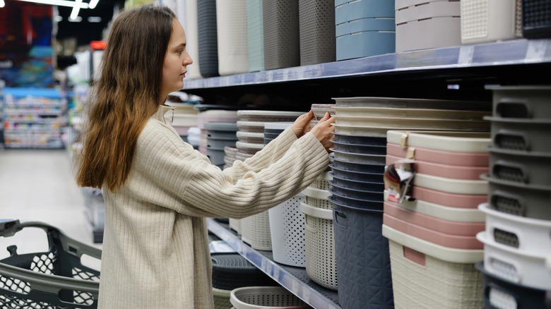 Woman shopping for storage bins at the store