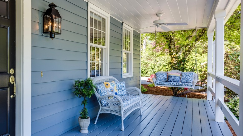 Blue and white porch with fan