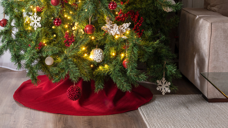Christmas tree with traditional red tree skirt
