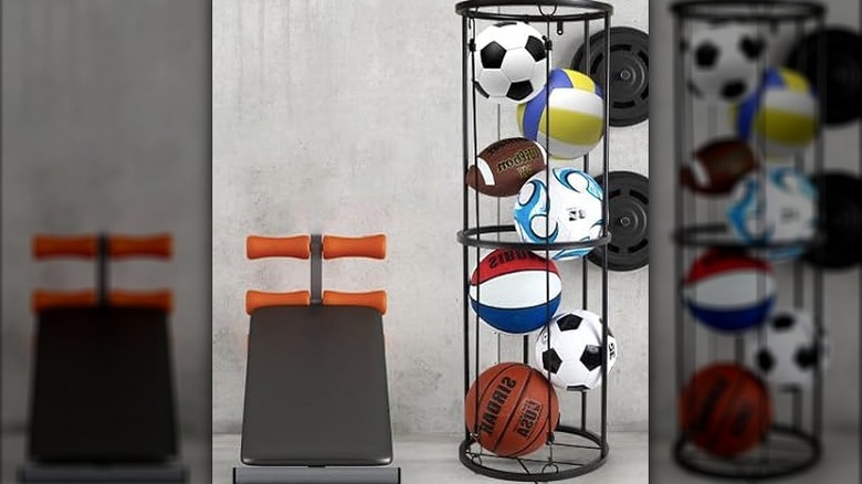 A metal ball organizer holding balls in a gym