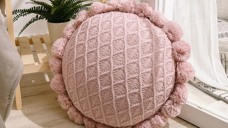 throw pillow with pom-poms