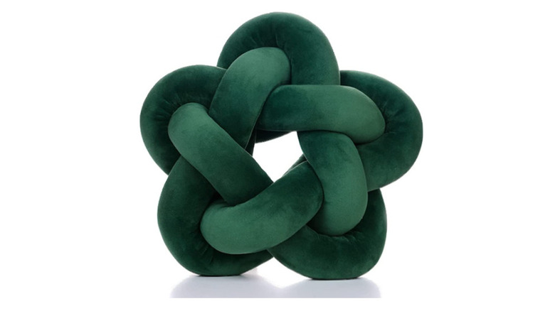 dark green knotted throw pillow