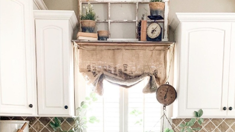 Burlap window shade over sink in kitchen