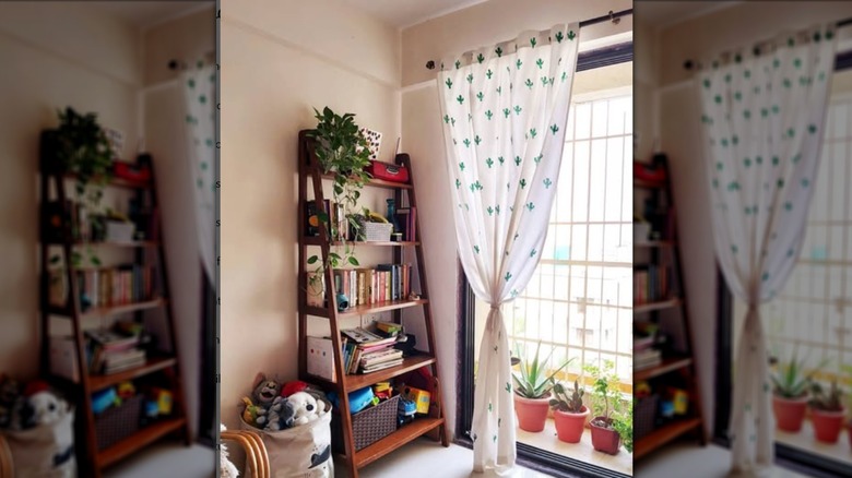 White sheer curtains stamped with cactus shape on window