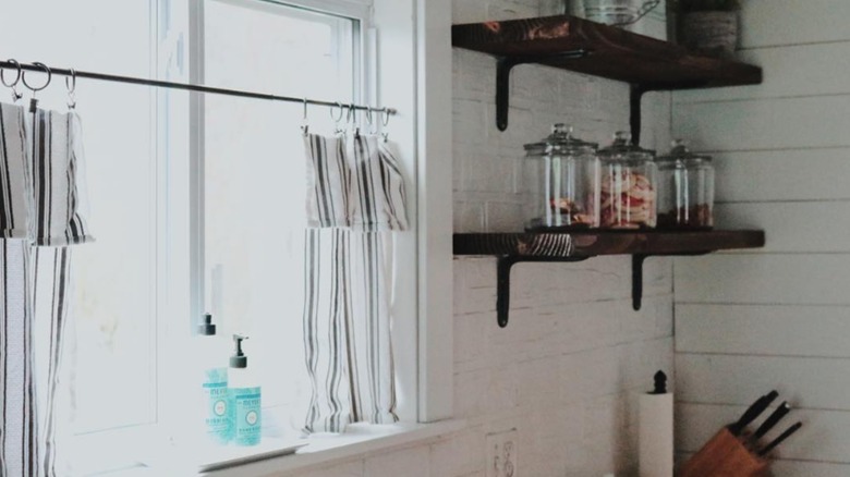 Striped tea towel curtains in kitchen window
