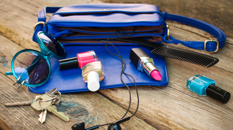 Open purse with random items spilled out