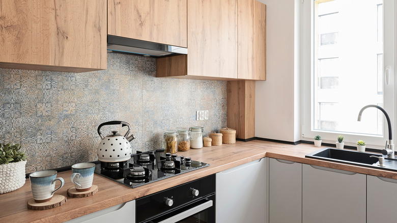 Small kitchen with counters and cabinets