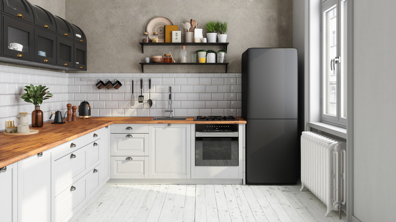 A kitchen with white painted floors