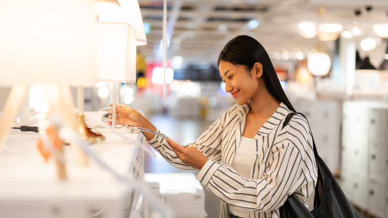 Woman shopping for lamp