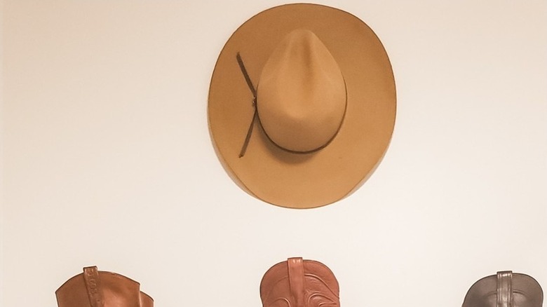 Felt hat hanging on an empty wall