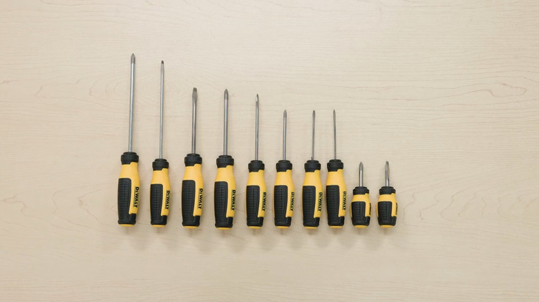 A 10-piece DeWalt screwdriver set laying on a wood surface