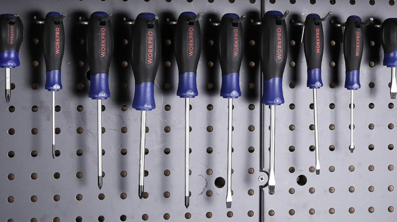 Workpro brand screwdrivers hanging on an organizer rack