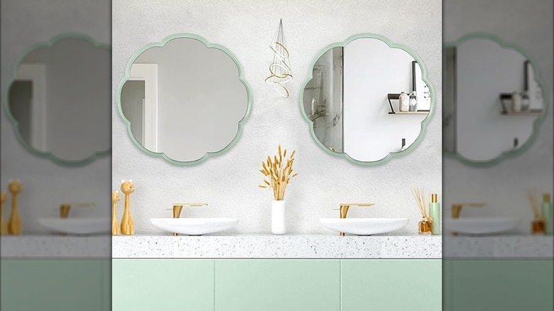 Two flower shaped bathroom mirrors.