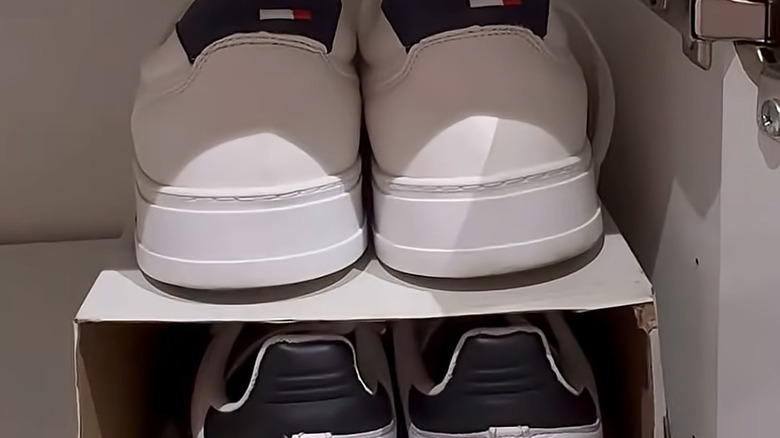 Shoes on shoe box shelf