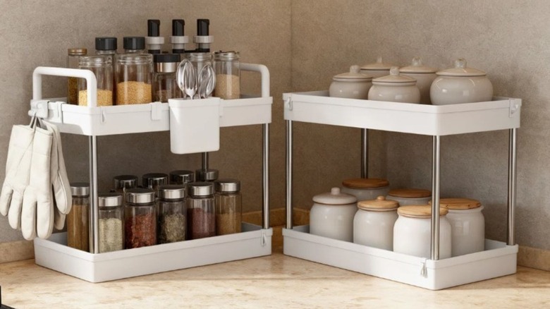 Four shelves sitting on a counter filled with spices