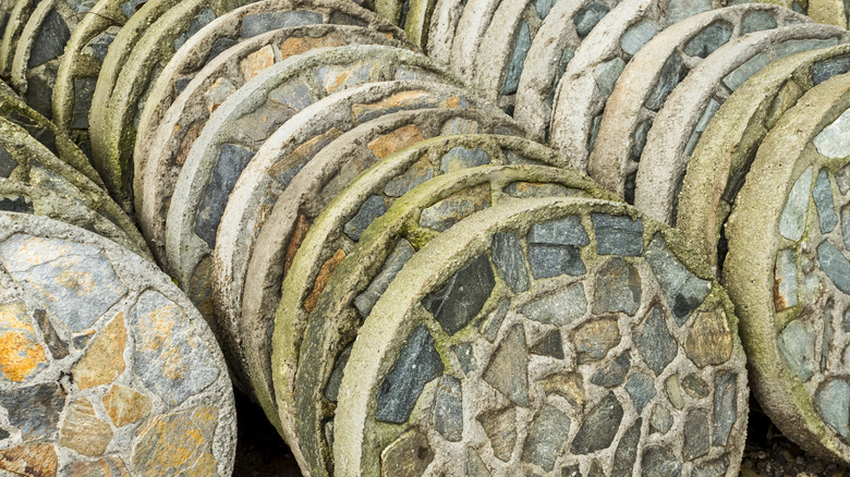 Many round stepping stones lined up standing on their edges