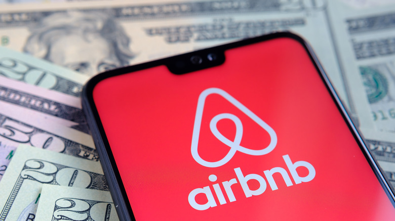 airbnb logo on screen of smartphone