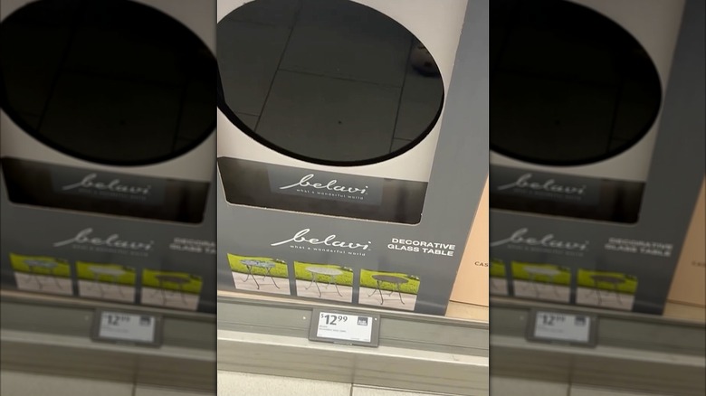 The Aldi Belavi foldable glass table in black.
