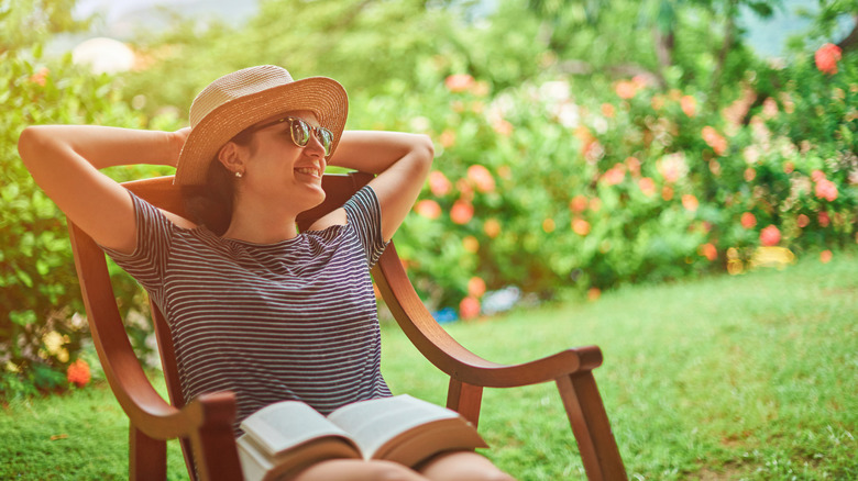 Someone sitting on a patio chair