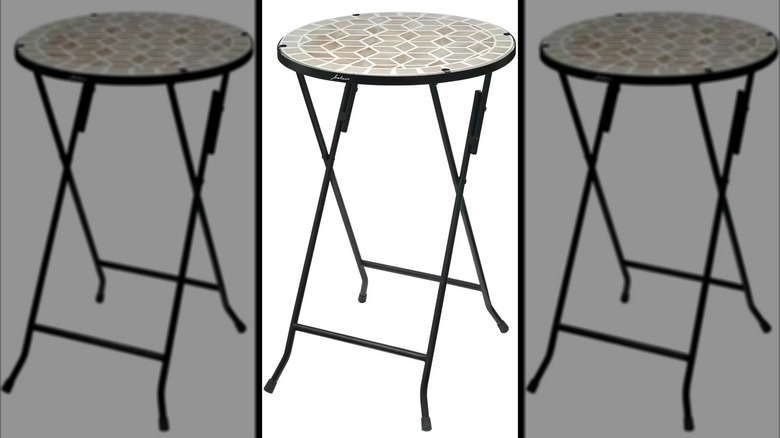 Aldi's brown foldable glass table on display.