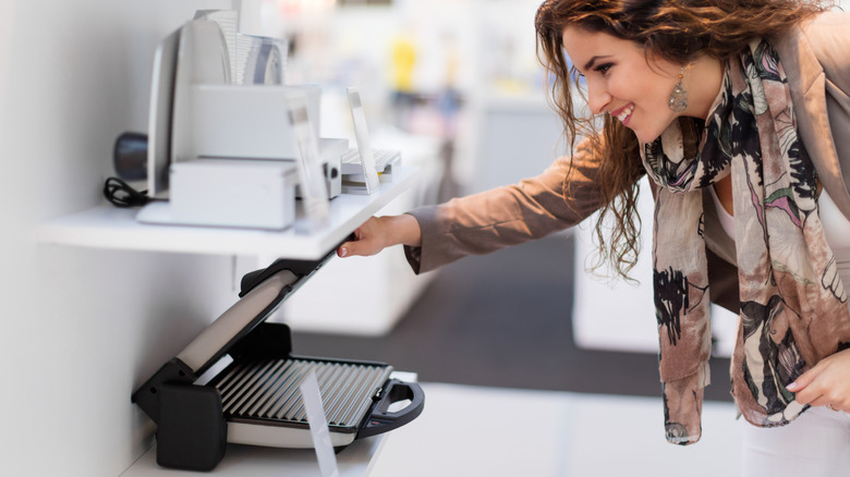 Woman looking at appliance