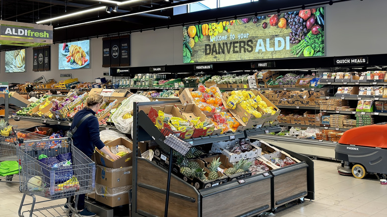 interior of an Aldi's market with shoppers in grocery section