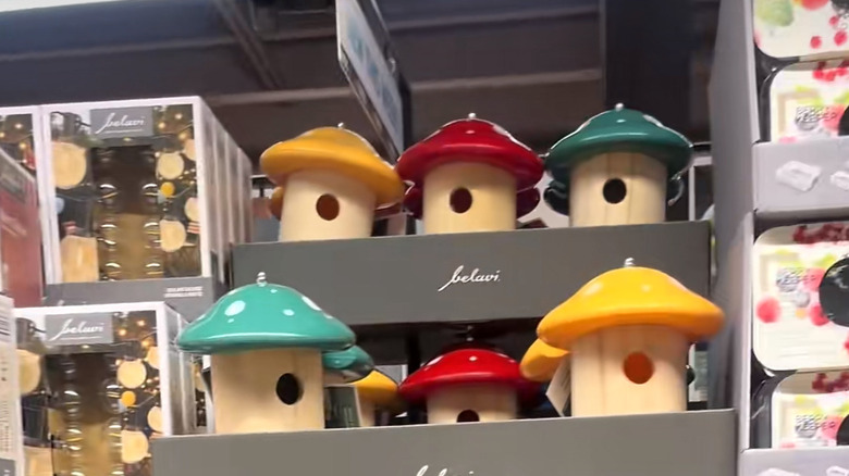 yellow green and red mushroom shaped birdhouses for sale at Aldi