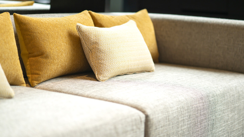 A close-up of a couch with throw pillows