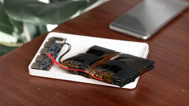 A swollen lithium-ion battery in an old power bank