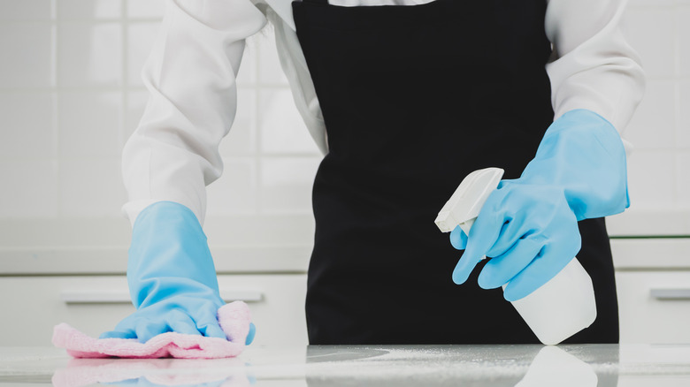 Person cleaning the kitchen