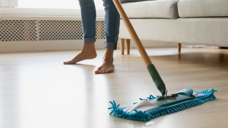 Woman mopping floor