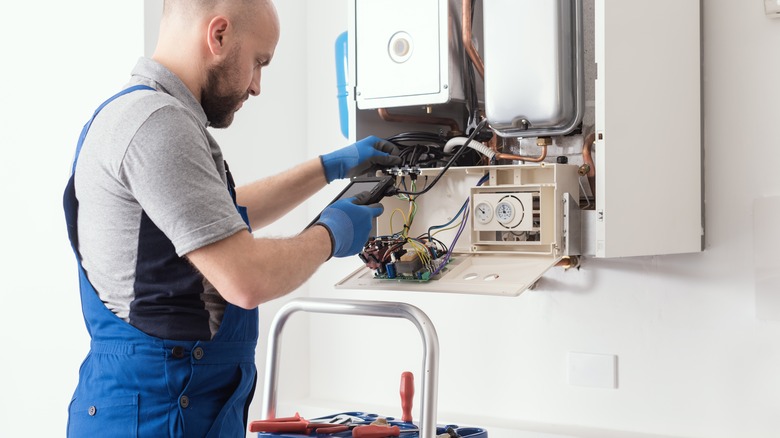 Person checking home mechanics