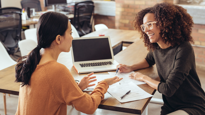 women going over documents