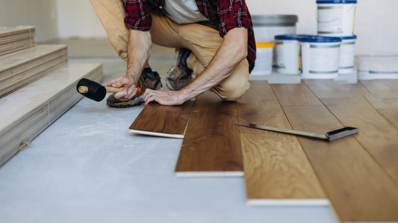 Person installing flooring